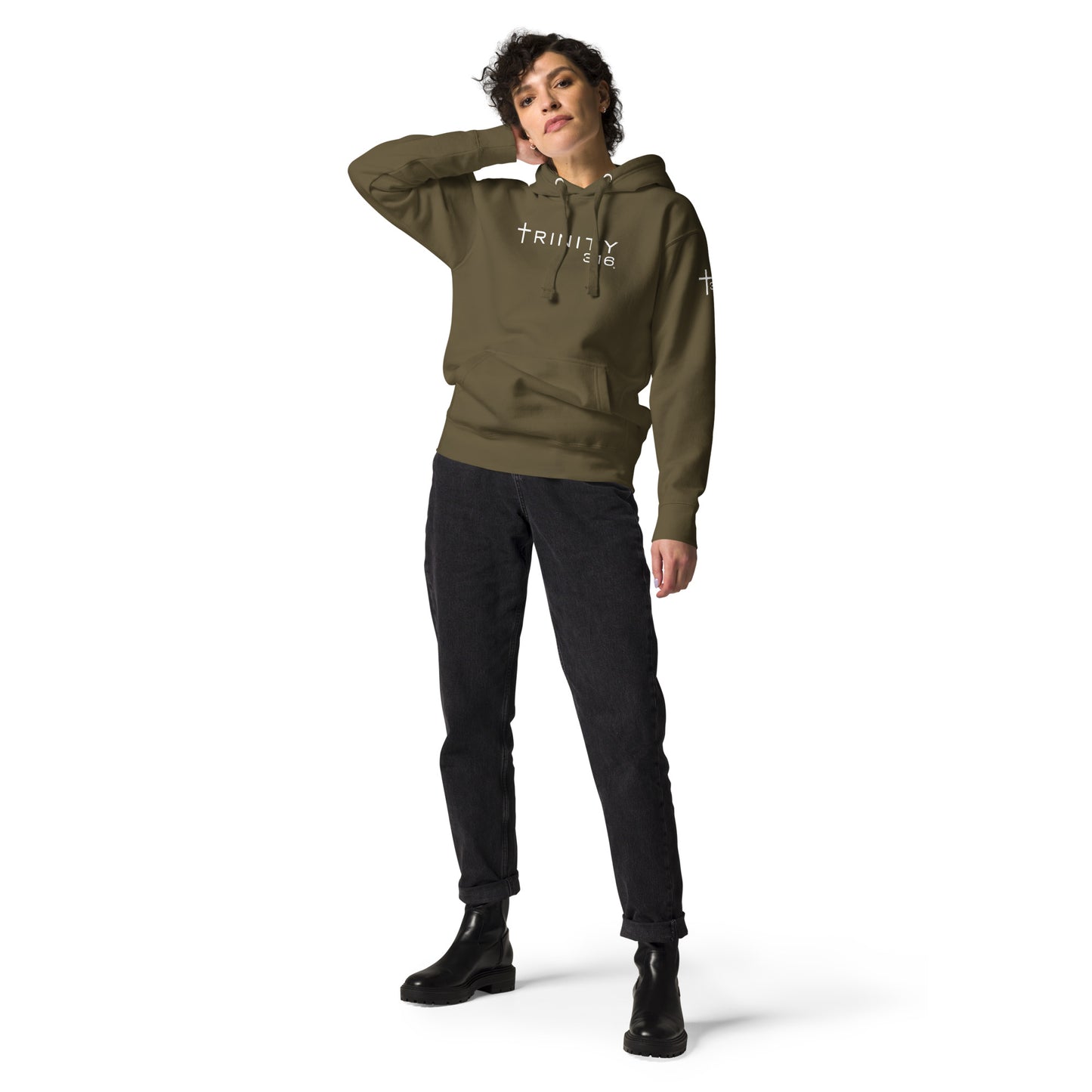 A woman in a military green unisex premium hoodie displaying the words Trinity t316 prominently on the front.