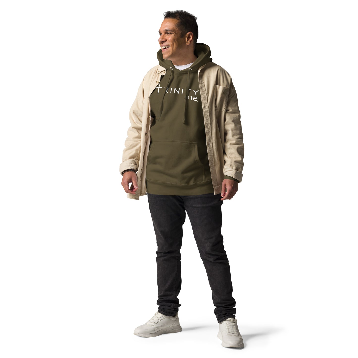 A man in a military green unisex premium hoodie and jeans poses confidently for a photo.
