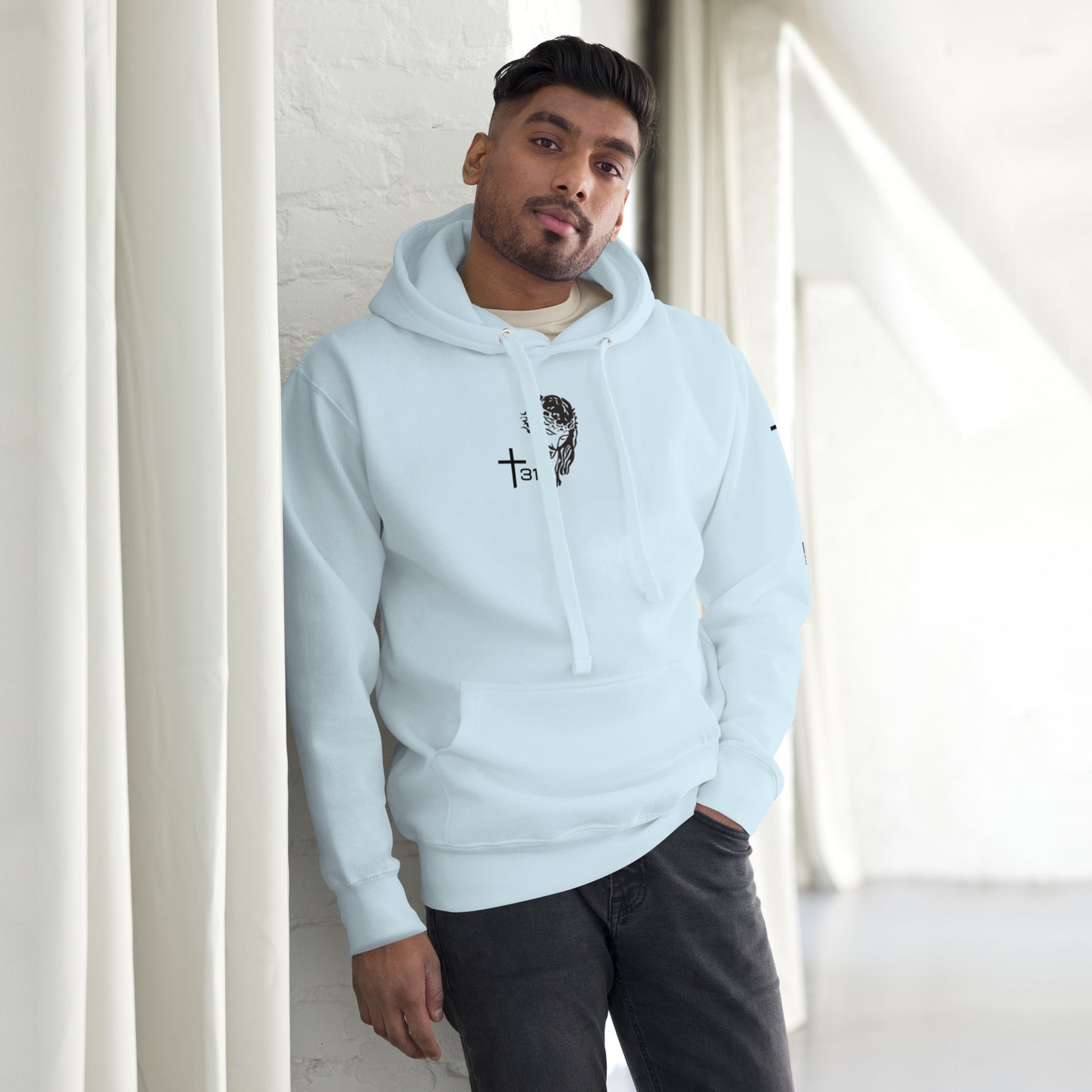 A man in a light blue hoodie, showcasing a stylish unisex premium hoodie in sky blue from the front view.