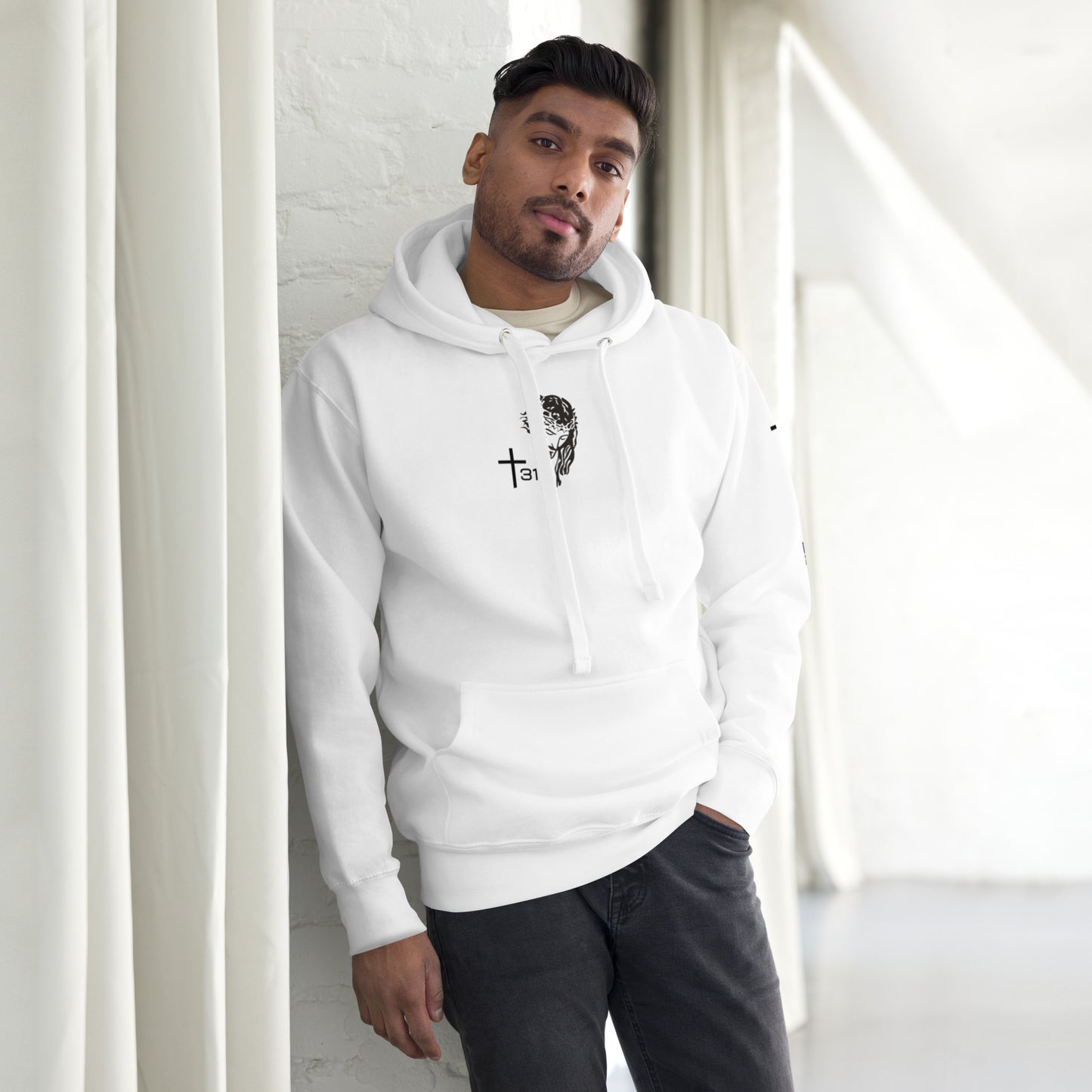 A man in a white hoodie featuring a logo, showcasing a stylish unisex premium hoodie design from the front.