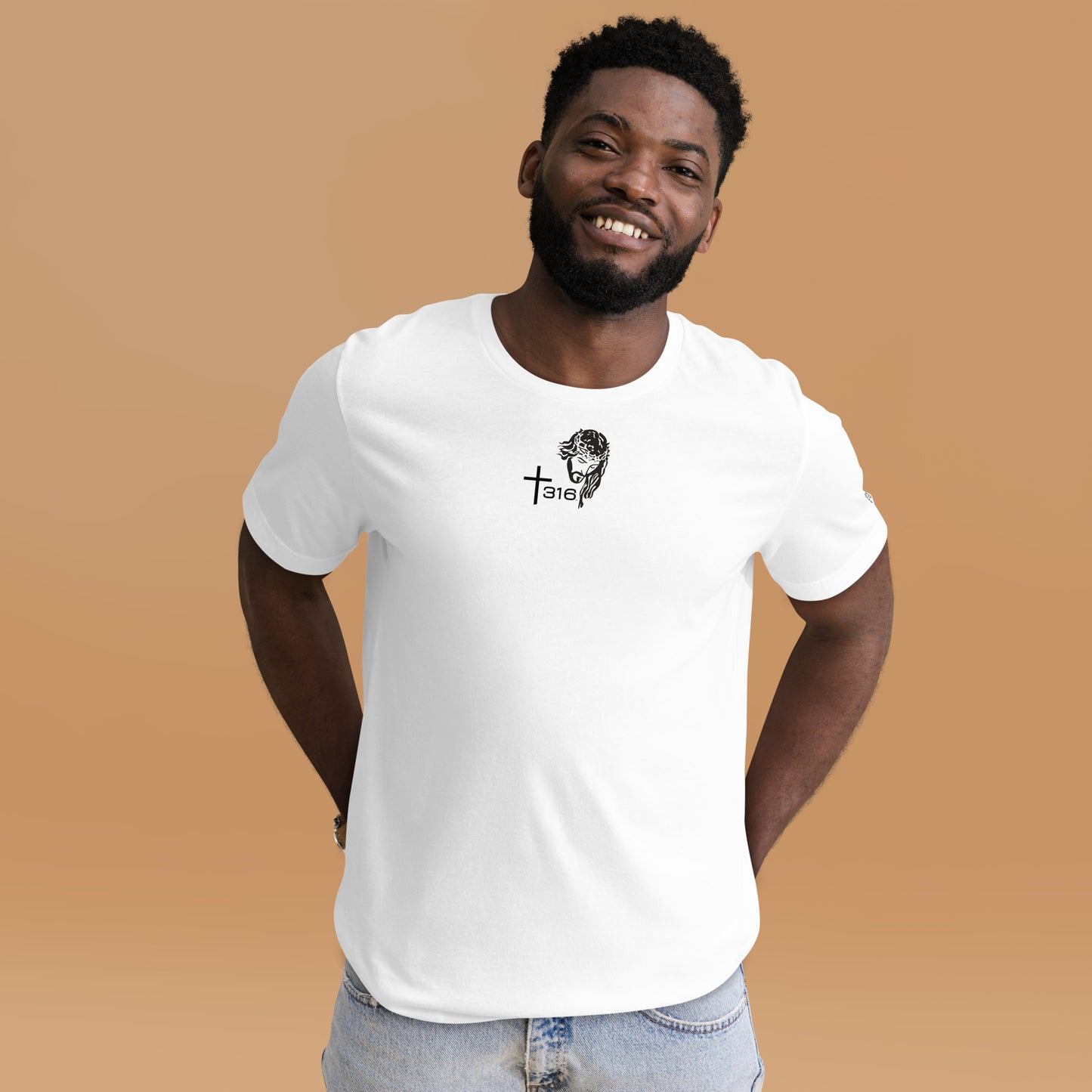 A black man in a white staple t-shirt featuring a logo, standing confidently against a neutral background.