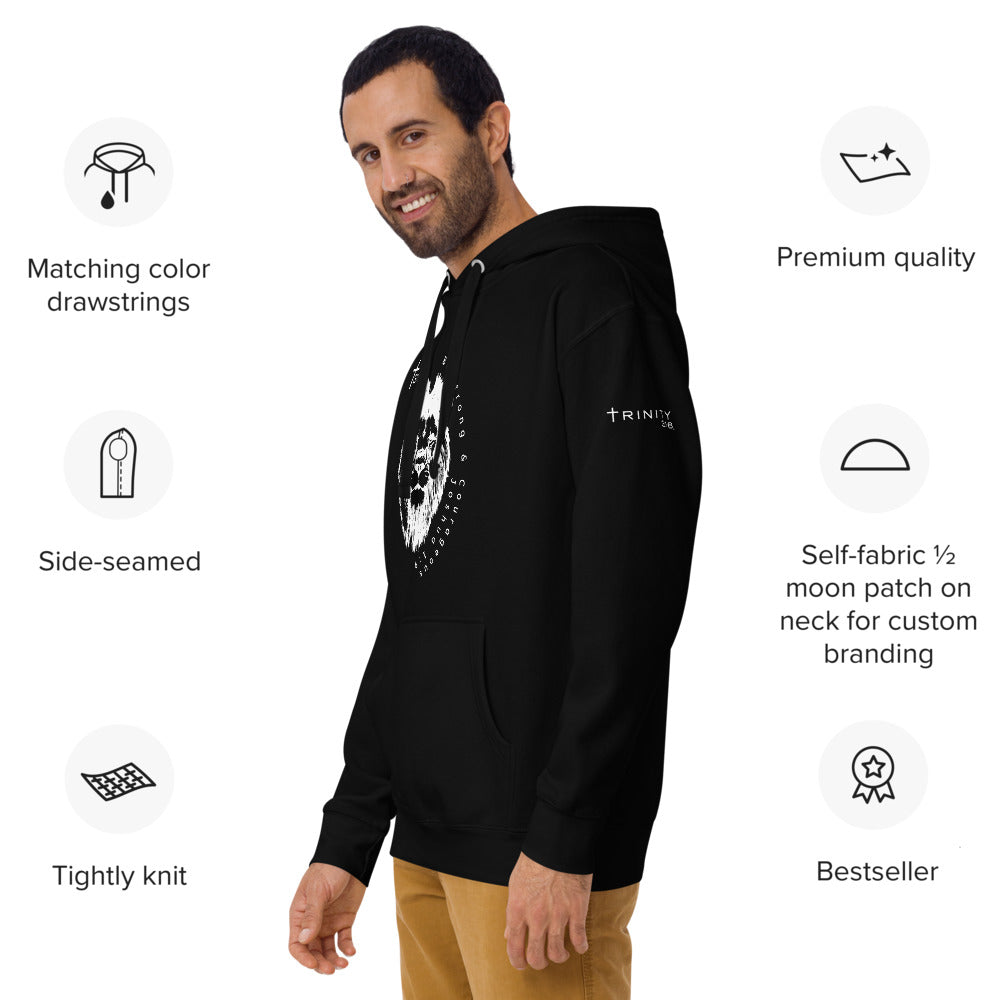 The image depicts a man wearing a black hoodie that reads "the man," highlighting its unisex premium style from the left front angle.
