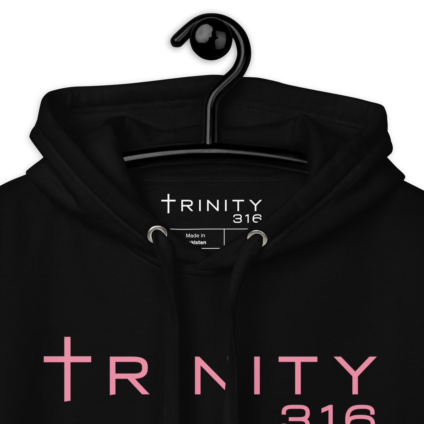 Premium black hoodie featuring the Trinity 365 logo, showcasing a close-up view of its fabric and design details.