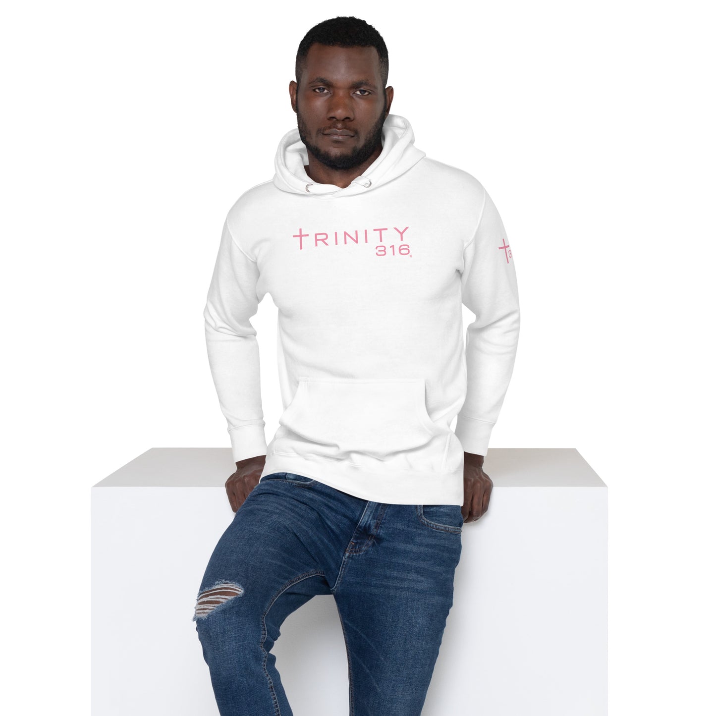 A man in a white hoodie featuring the word "Trinity" prominently displayed on the front.