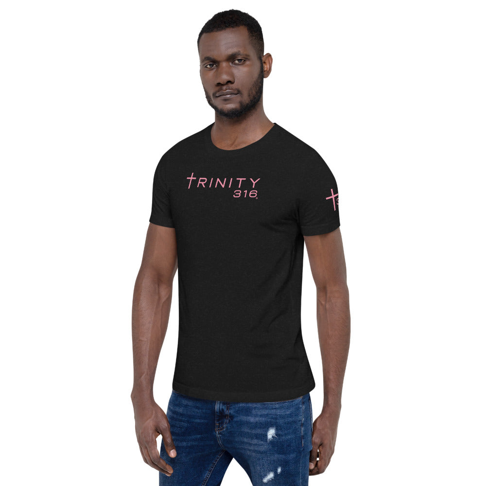 A man in a black t-shirt featuring pink lettering, showcasing a stylish and casual look from the left front view.