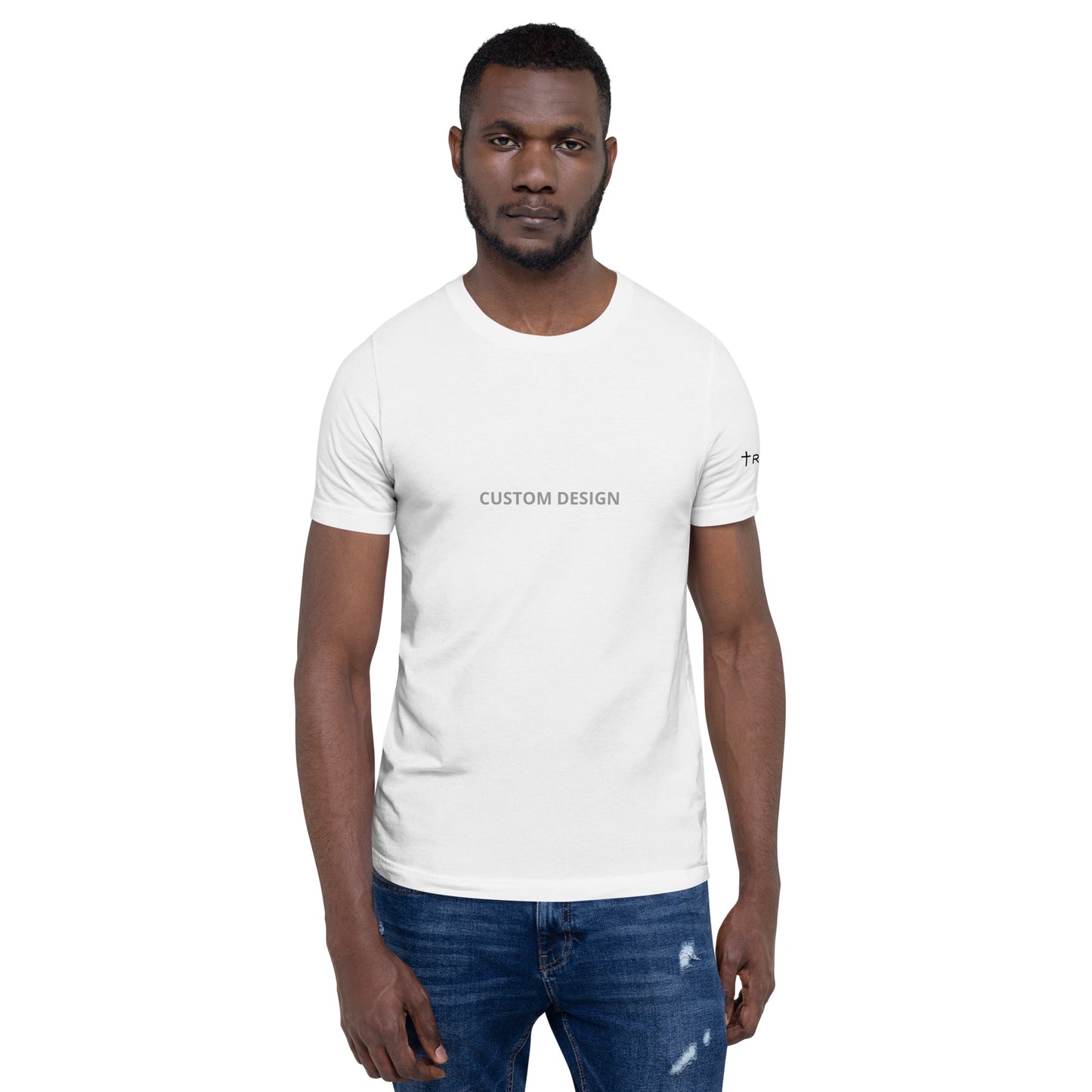 A man in a white unisex staple t-shirt featuring the words custom made prominently displayed on the front.